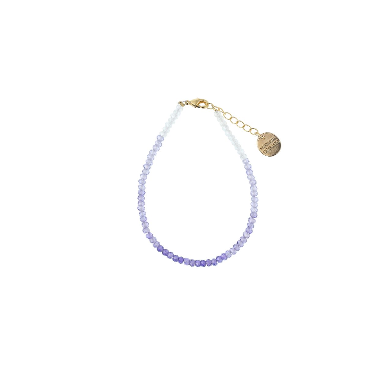 Bracelet fin Mademoiselle Antoinette en perles de verre facetté avec un dégradé tie and dye allant du blanc au violet violine foncé, doré à l'or fin.